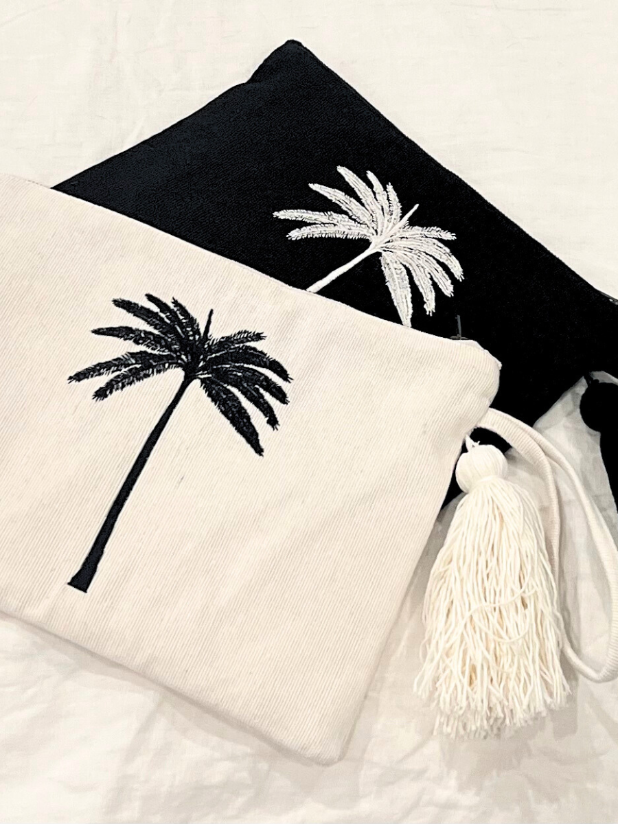 Coastal pouch accessory black and white tassel